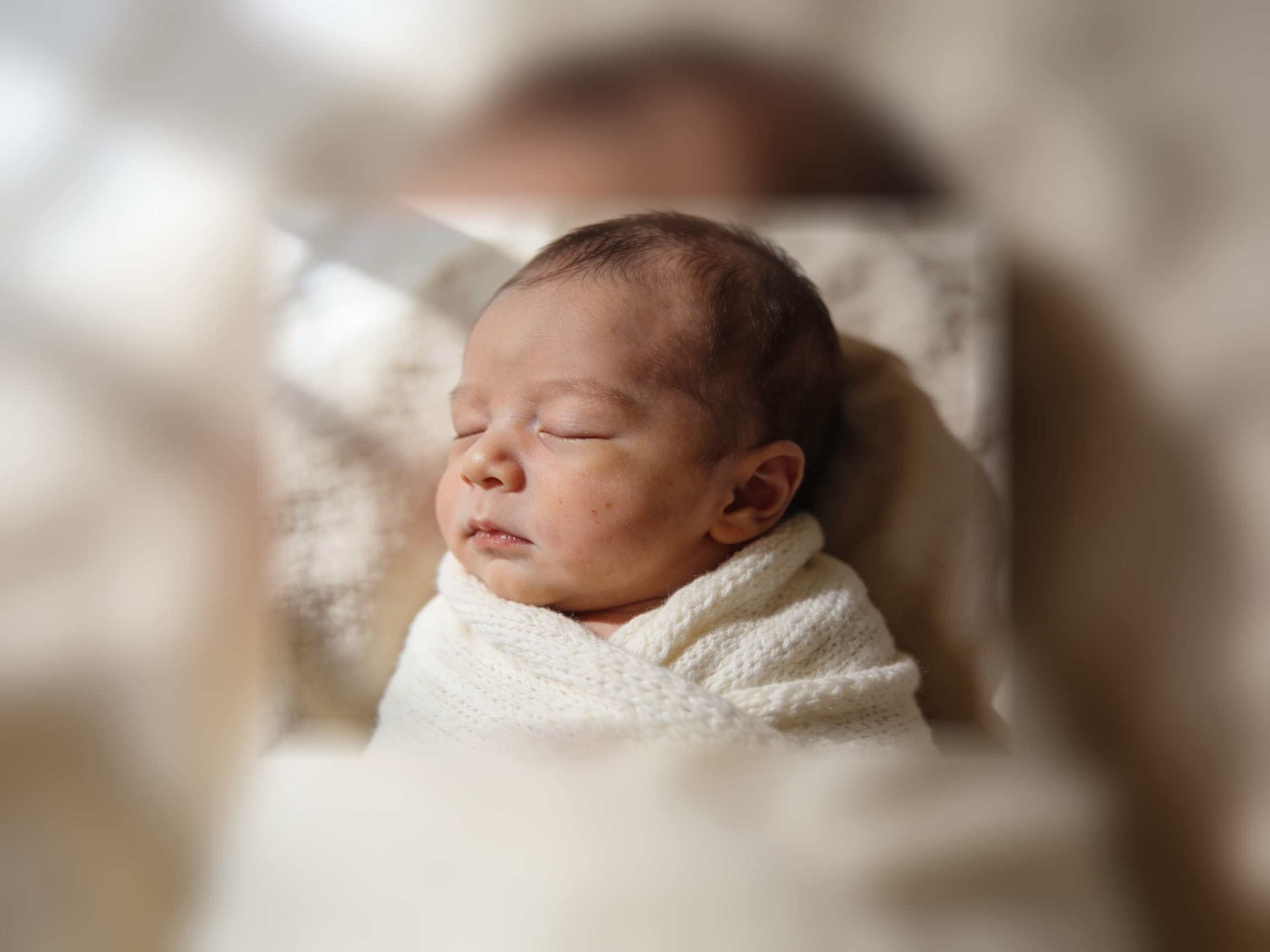 Why Choose a Professional Newborn Photographer?